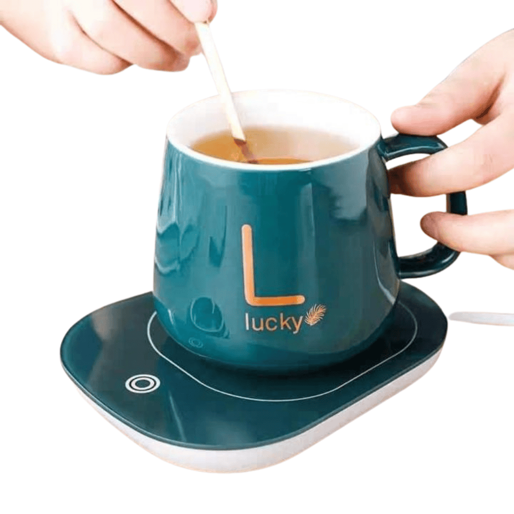 Full image of the warmer placed on a desk with a cup.