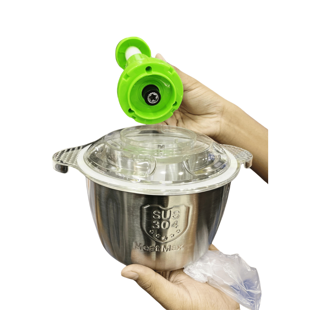 Hand holding a stainless steel container with a green nozzle on a white background