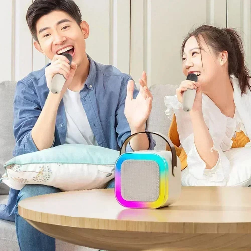 Boy and girl using the speaker and mic for singing and fun