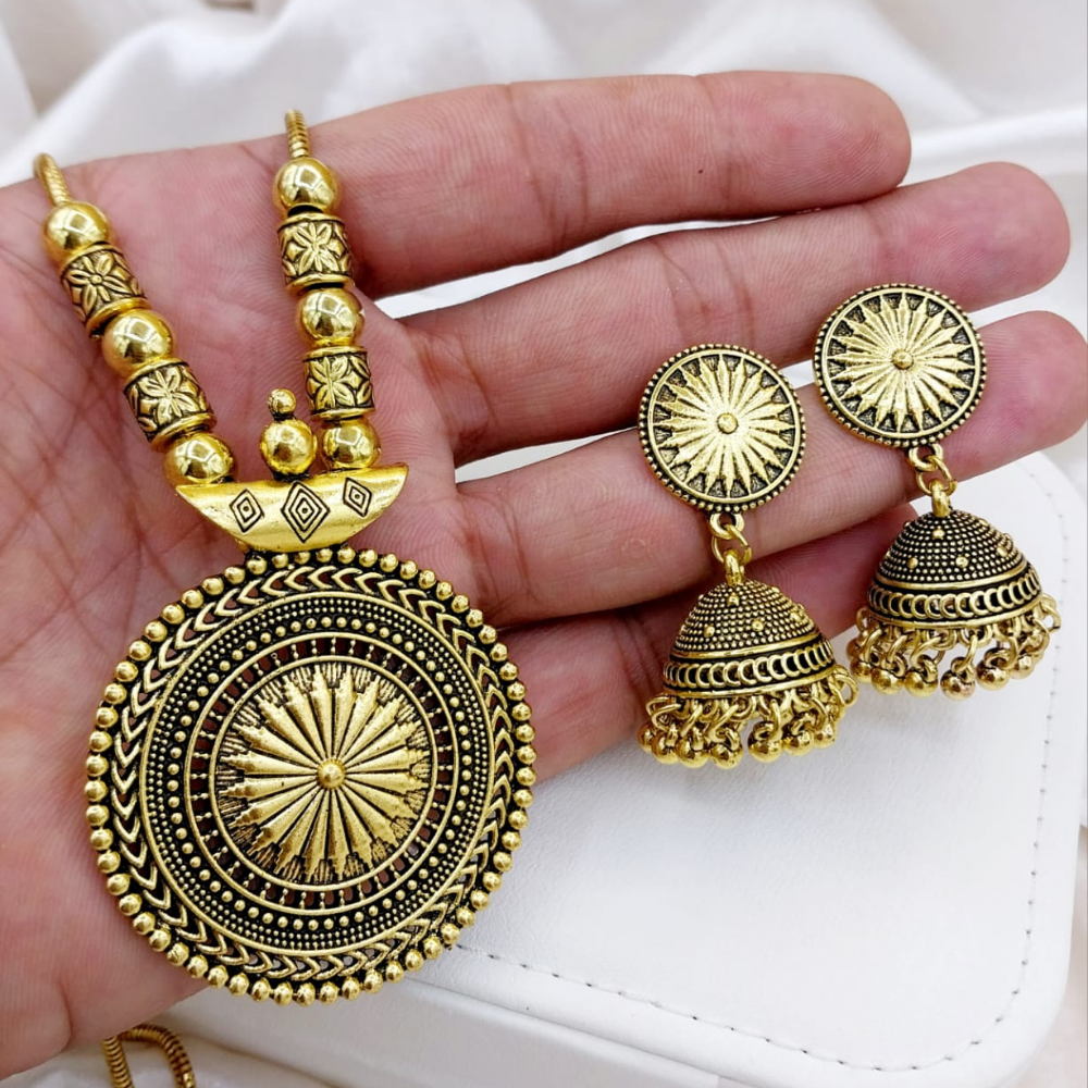 Side angle of golden China necklace set with earrings