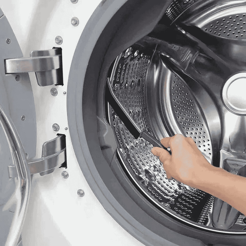 Cleaning brush shown on a stainless steel panel surface