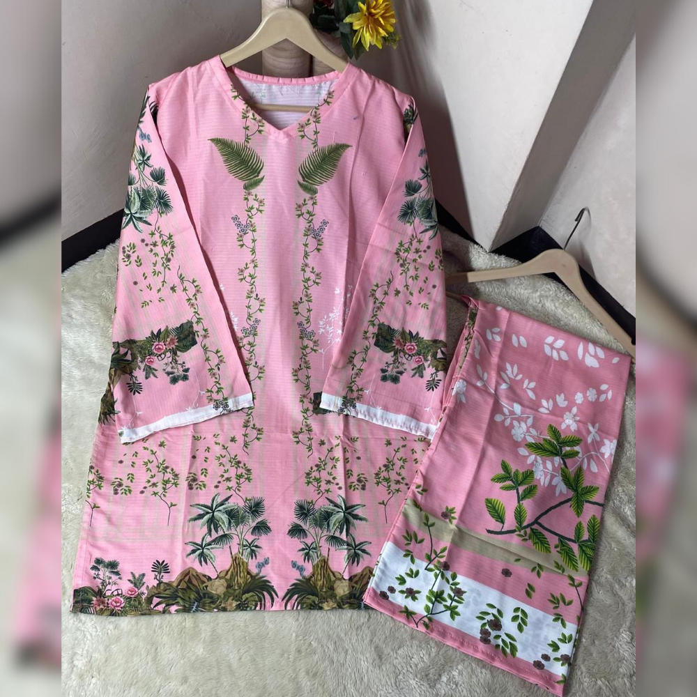 Pink floral outfit on a hanger against a white wall