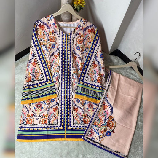 Colorful embroidered garment on a hanger against a neutral background