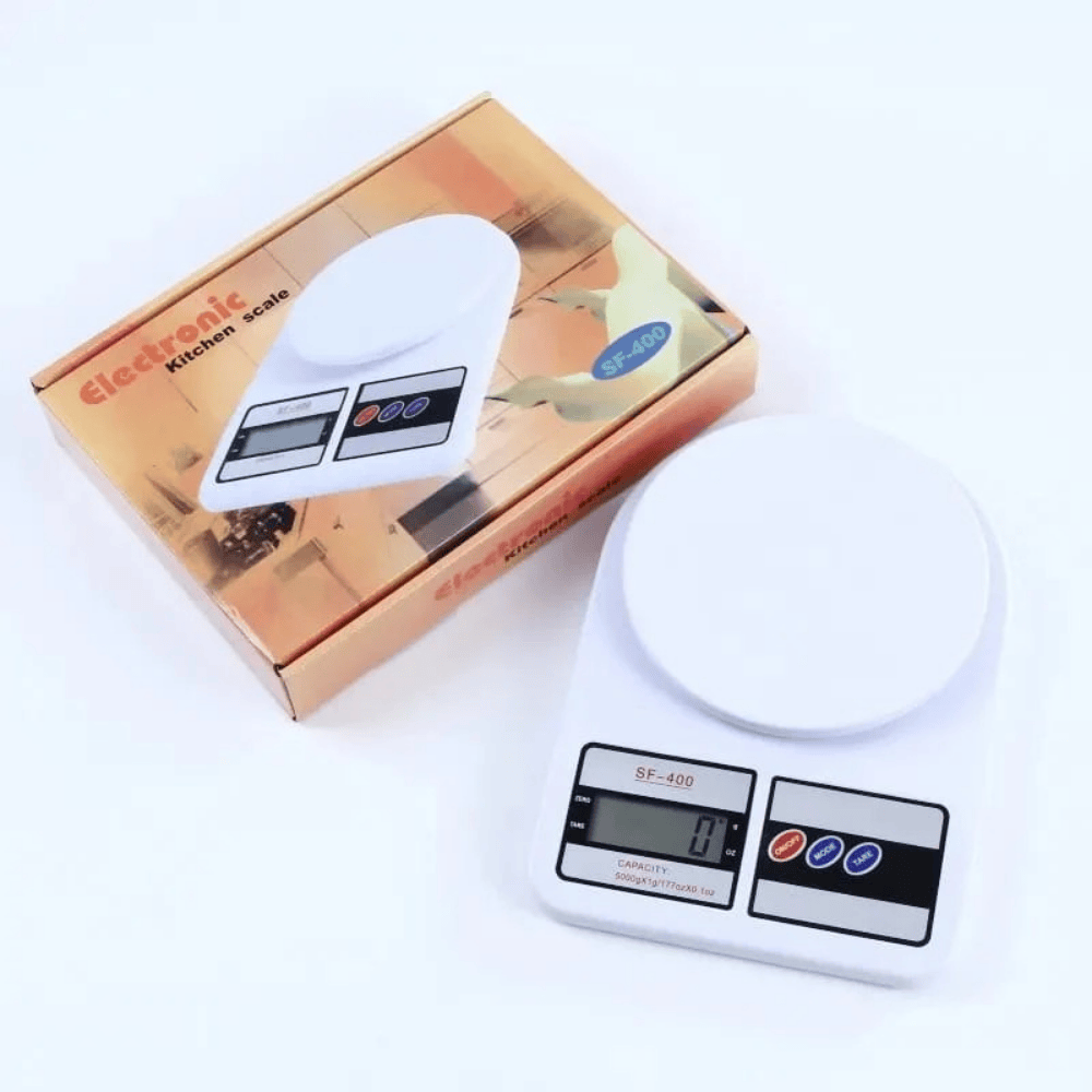Digital kitchen scale with packaging on a white background
