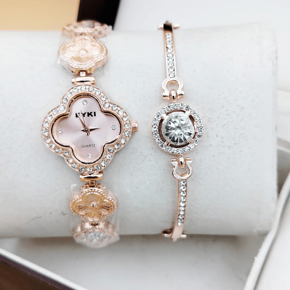 Close-up view of golden ladies watch with bracelet.
