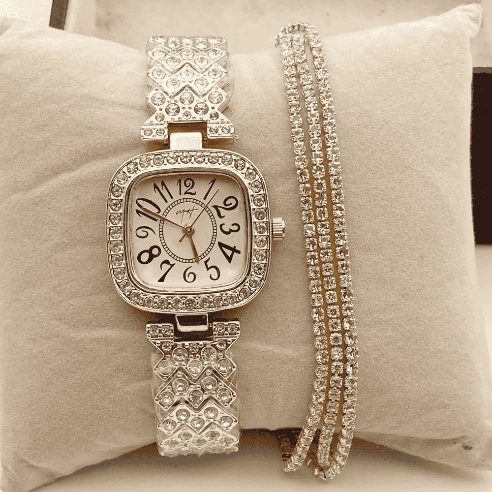 Silver watch with diamond-studded band on a beige cushion