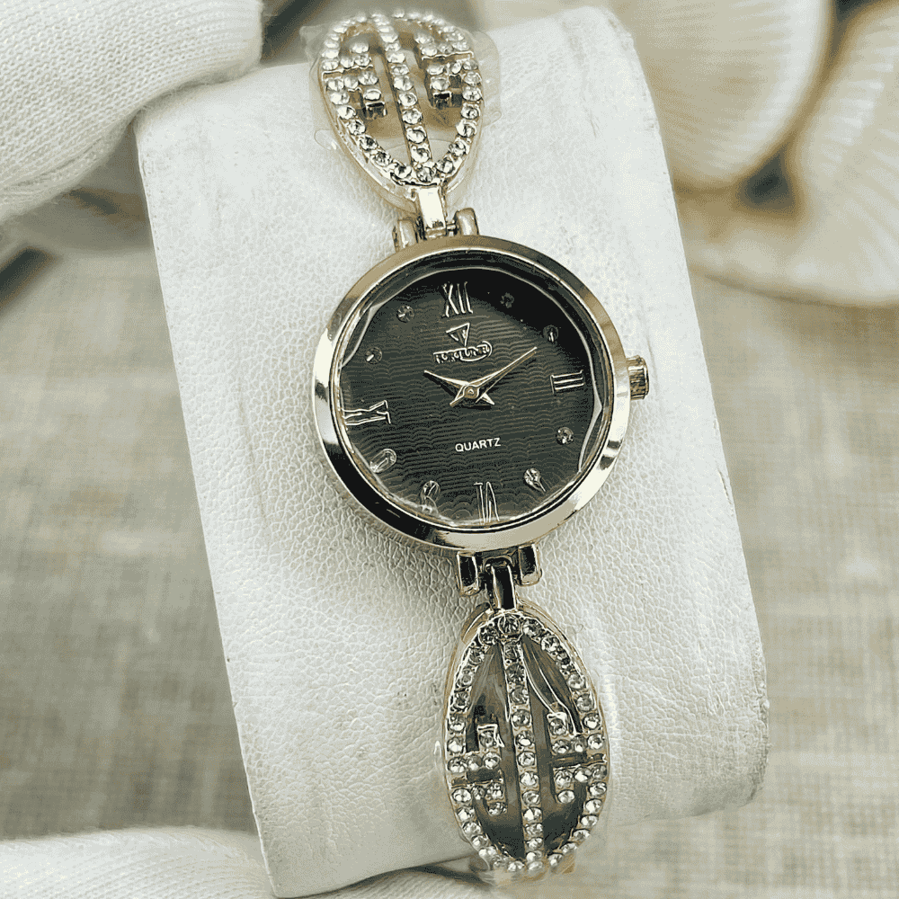 Silver watch with decorative chain on a white stand