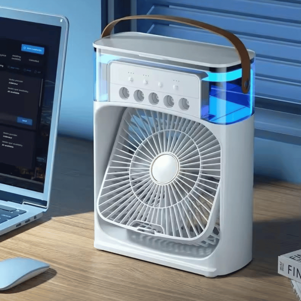Portable air purifier on a desk next to a laptop