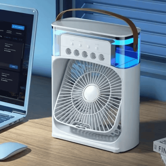 Portable air purifier on a desk next to a laptop
