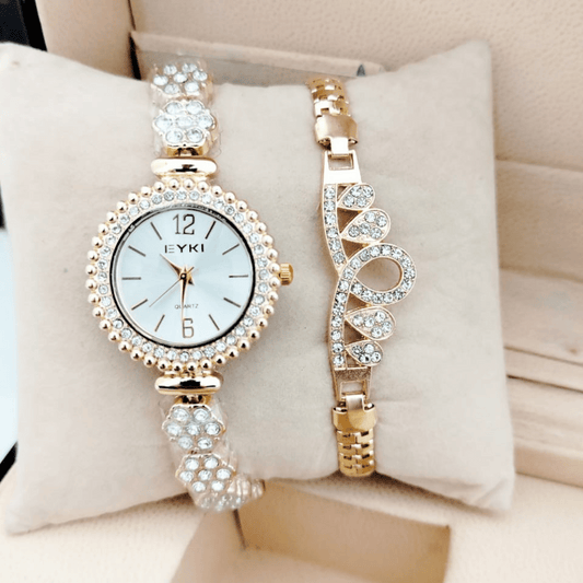 gold ladies watch with diamond crystal bracelet on cushion display