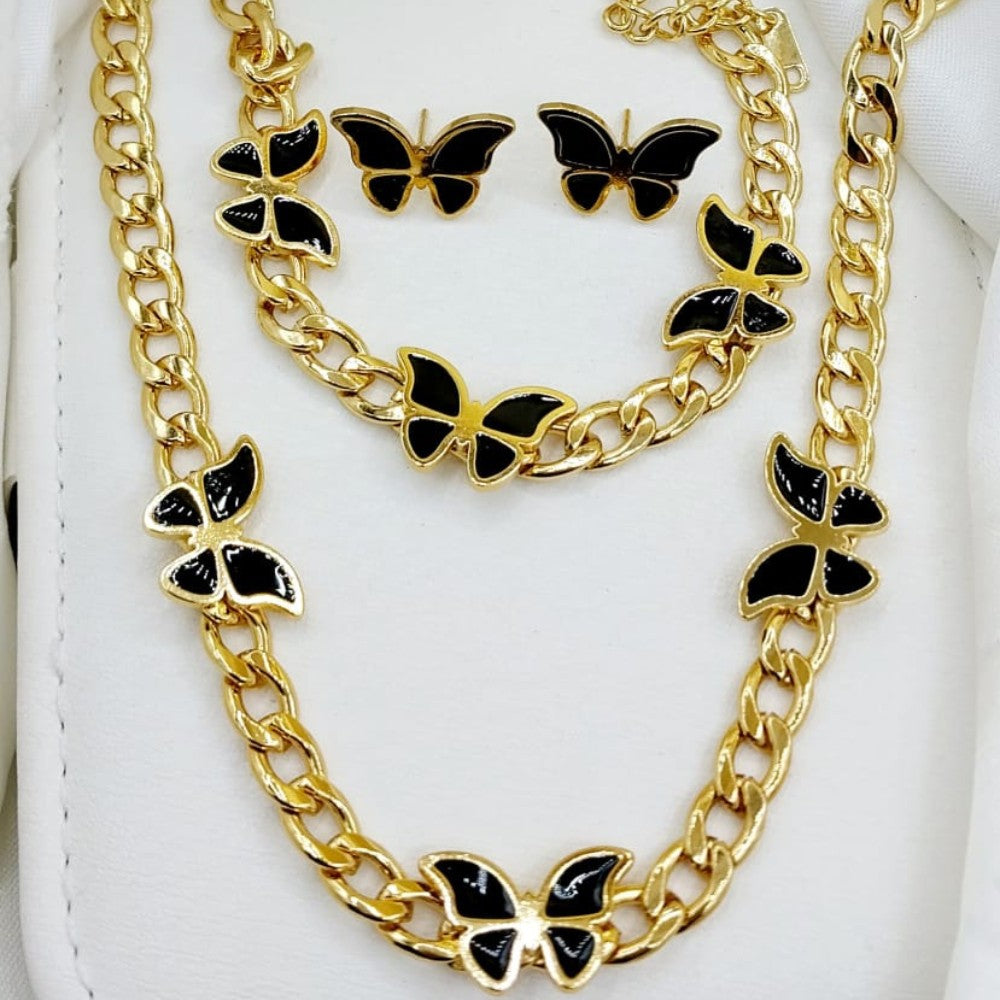 Gold chain necklace with black butterfly charms on a white background