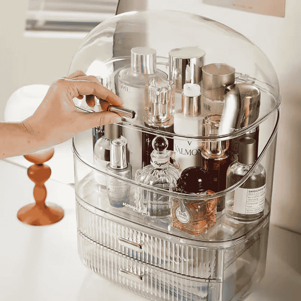 Clear acrylic cosmetic organizer with skincare products on a white surface.