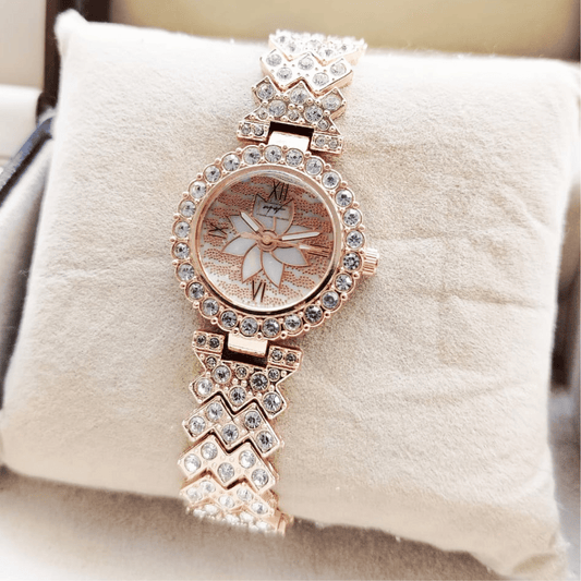 Front view of MH Stone rose gold ladies jewelery watch.