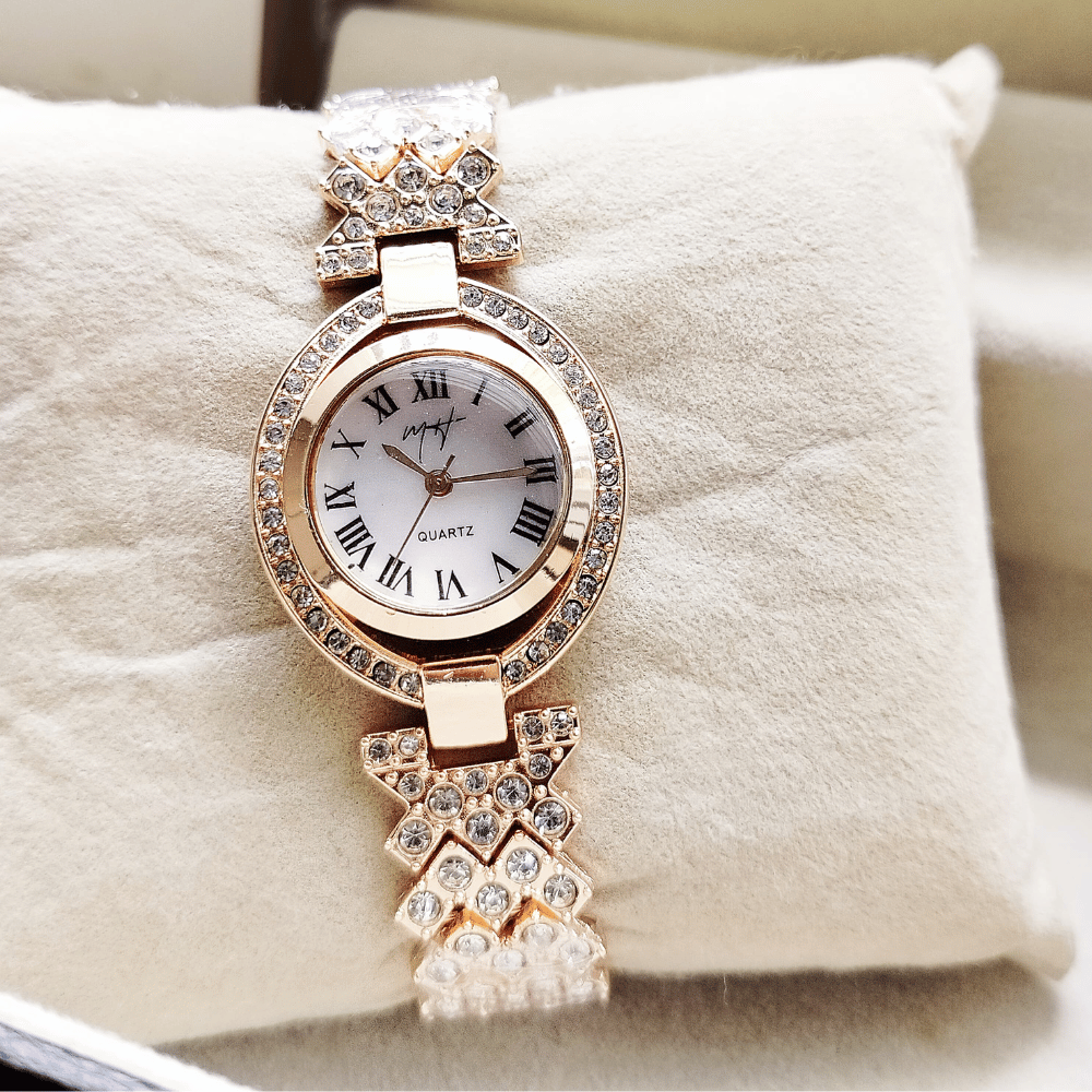 Detailed close-up of the golden MH Stone ladies jewelry watch.