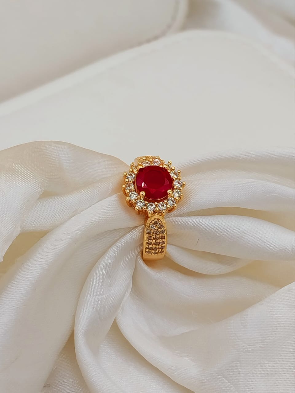 Bright red artificial ring with gold plating