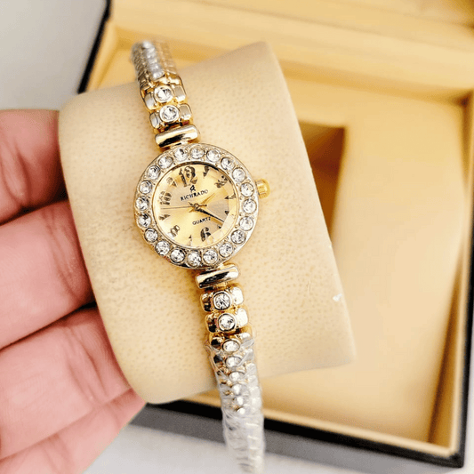 Main product view of golden watch with rose-colored dial