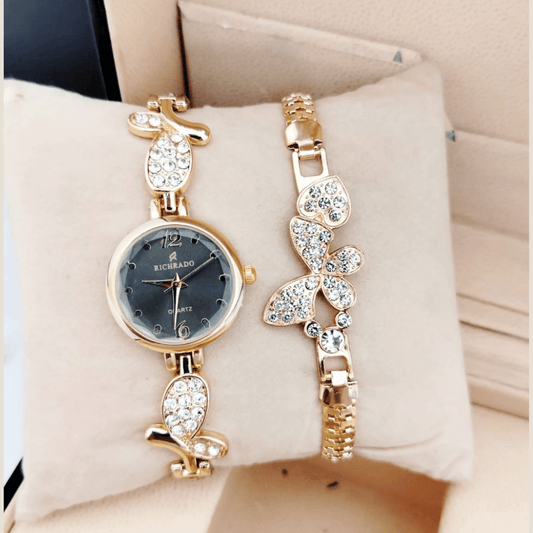 Ricrado gold ladies watch with black dial and butterfly chain bracelet on cushion
