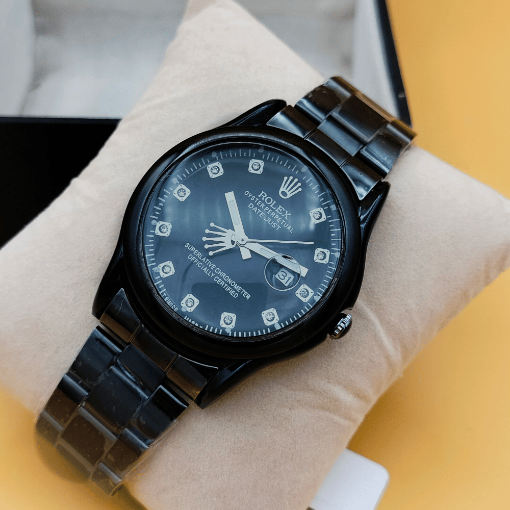 Close-up view of Rolex date black stainless steel watch