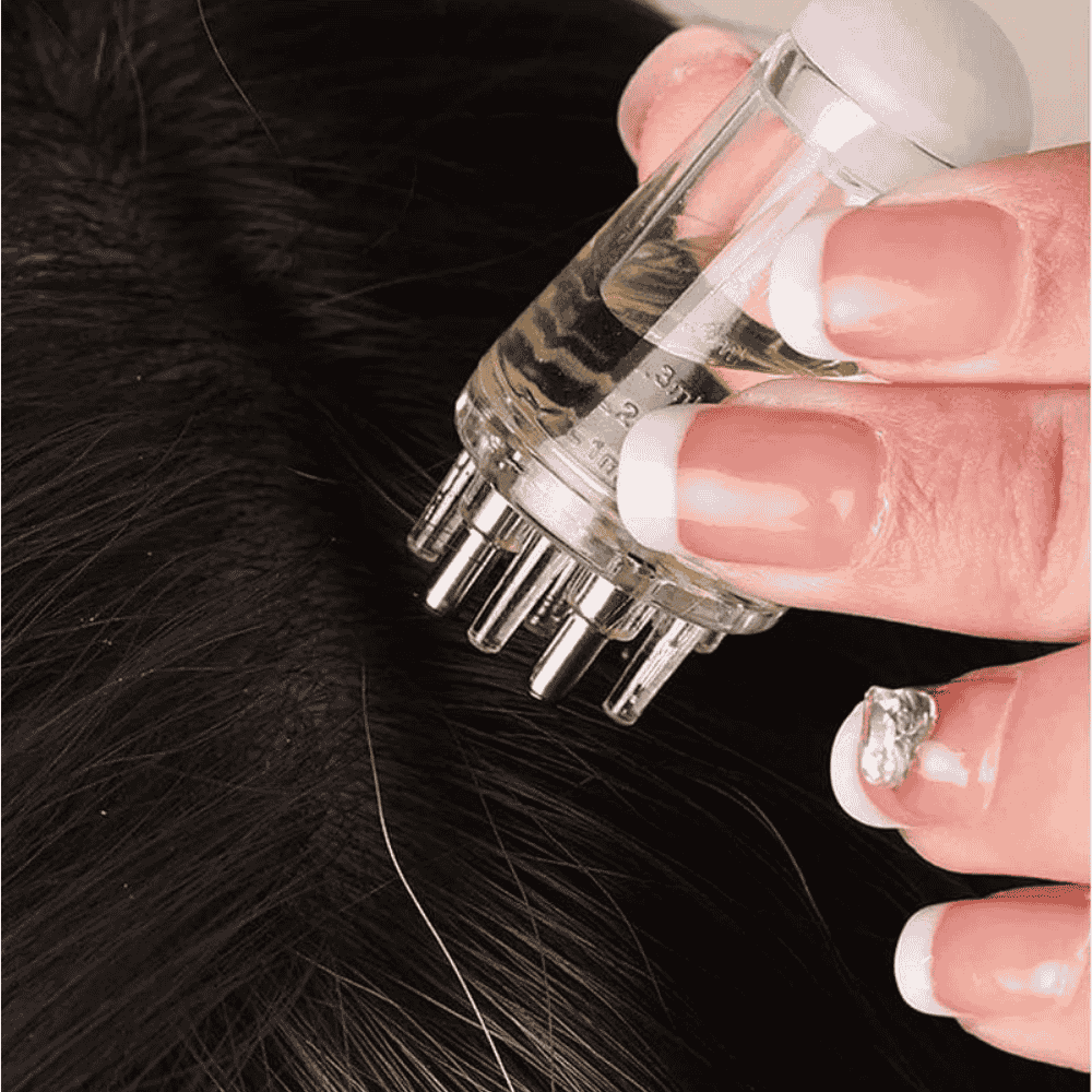 Detailed view of scalp dispenser tip and grip