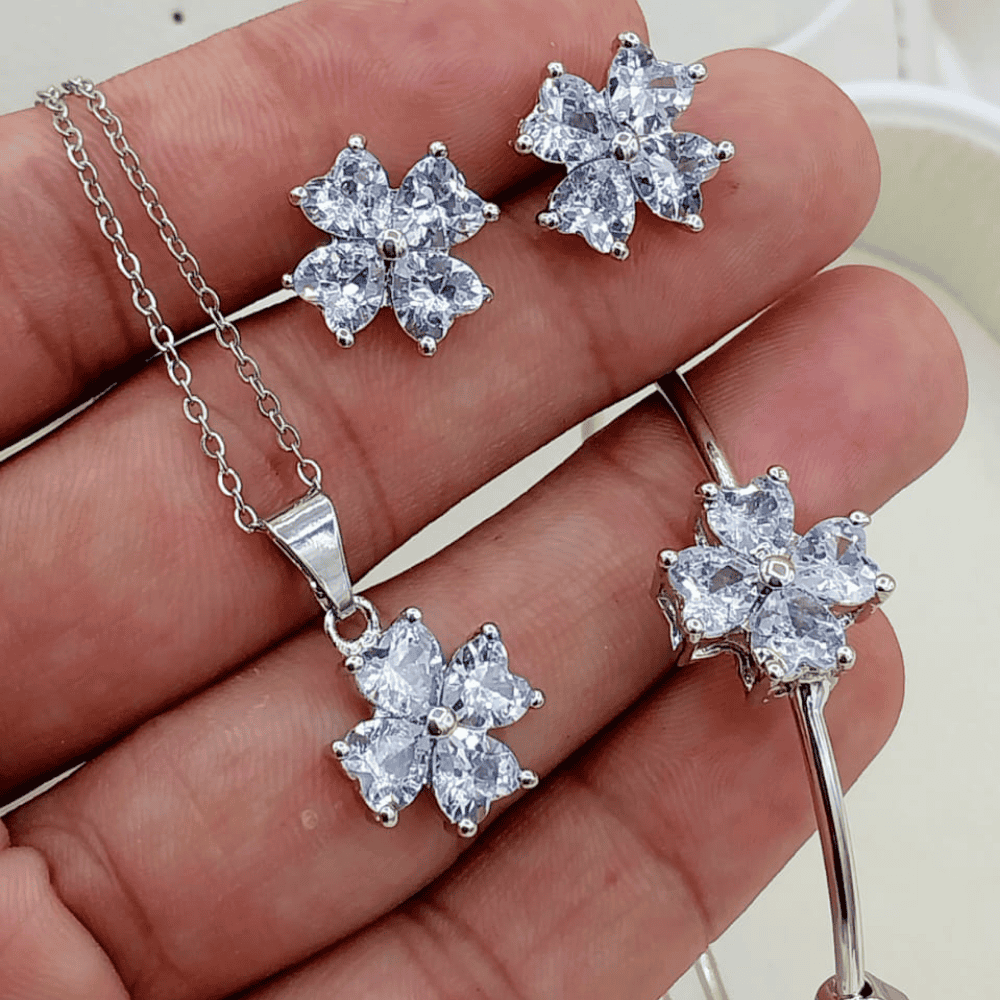 Close-up view of the silver locket set being held in hand