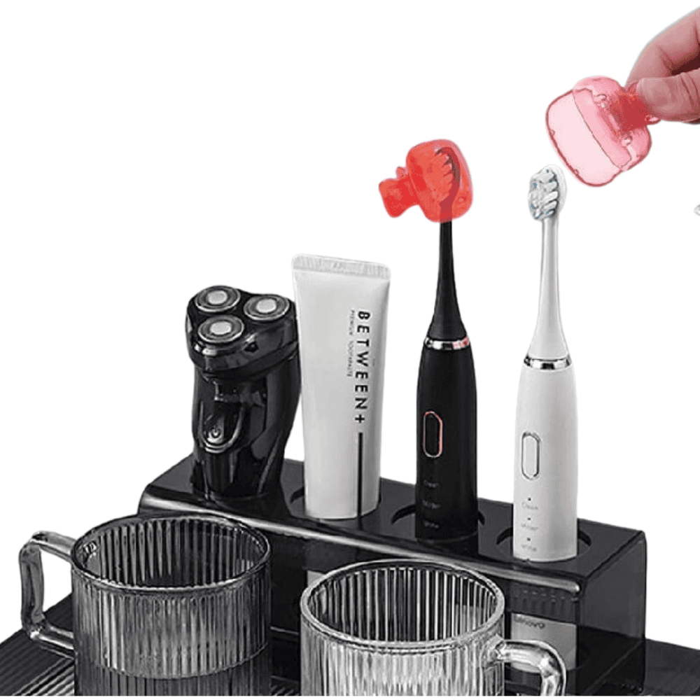 Side profile of a toothbrush placed on a stand, fitted with a cover