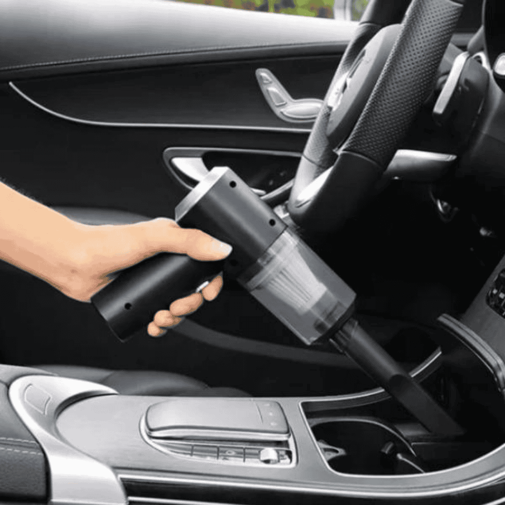 Left front view of the vacuum cleaner being used in a car