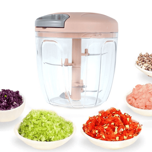 Handheld food chopper with chopped vegetables on a white background