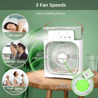 Portable fan with three speed settings on a wooden table against a green background