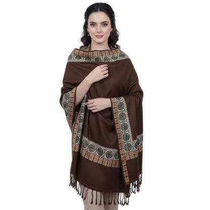 Woman wearing a brown patterned scarf on a white background