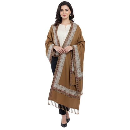 Woman wearing a brown patterned shawl on a white background