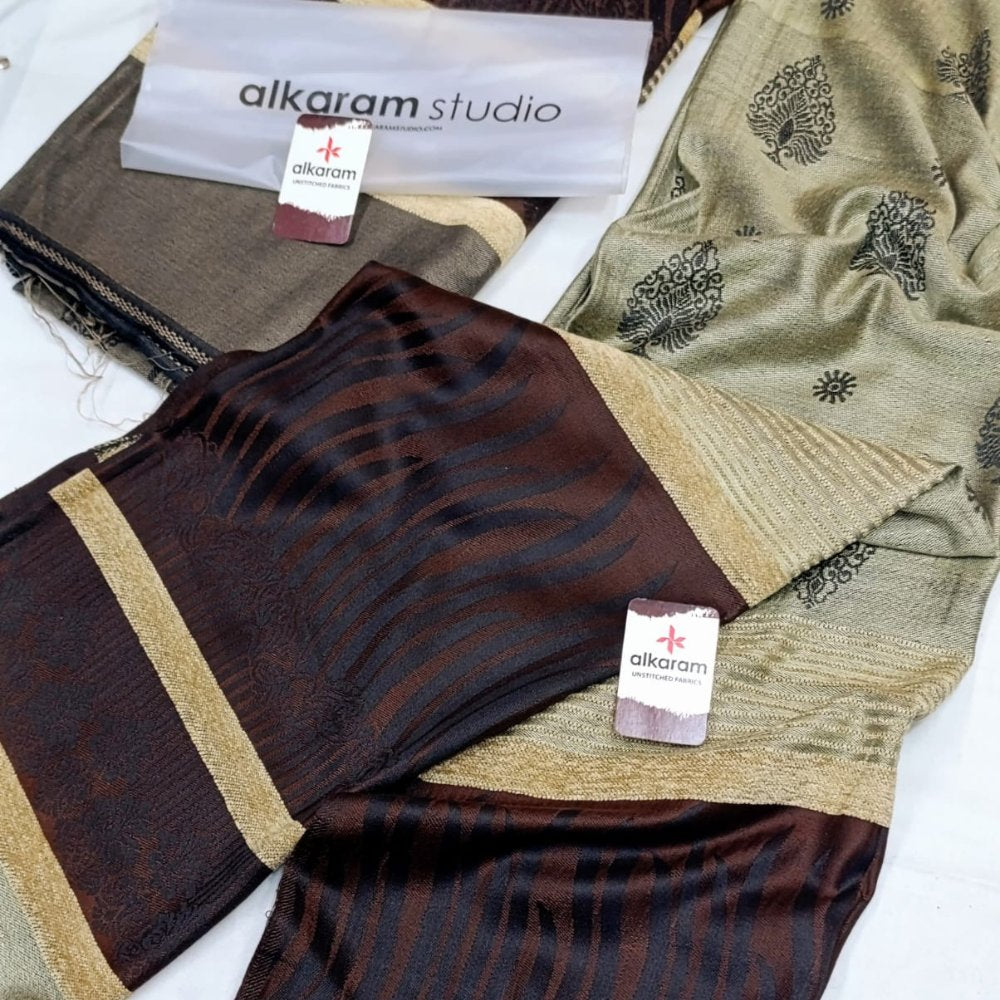 Fabric swatches with patterns and 'alkaram studio' branding on a white background