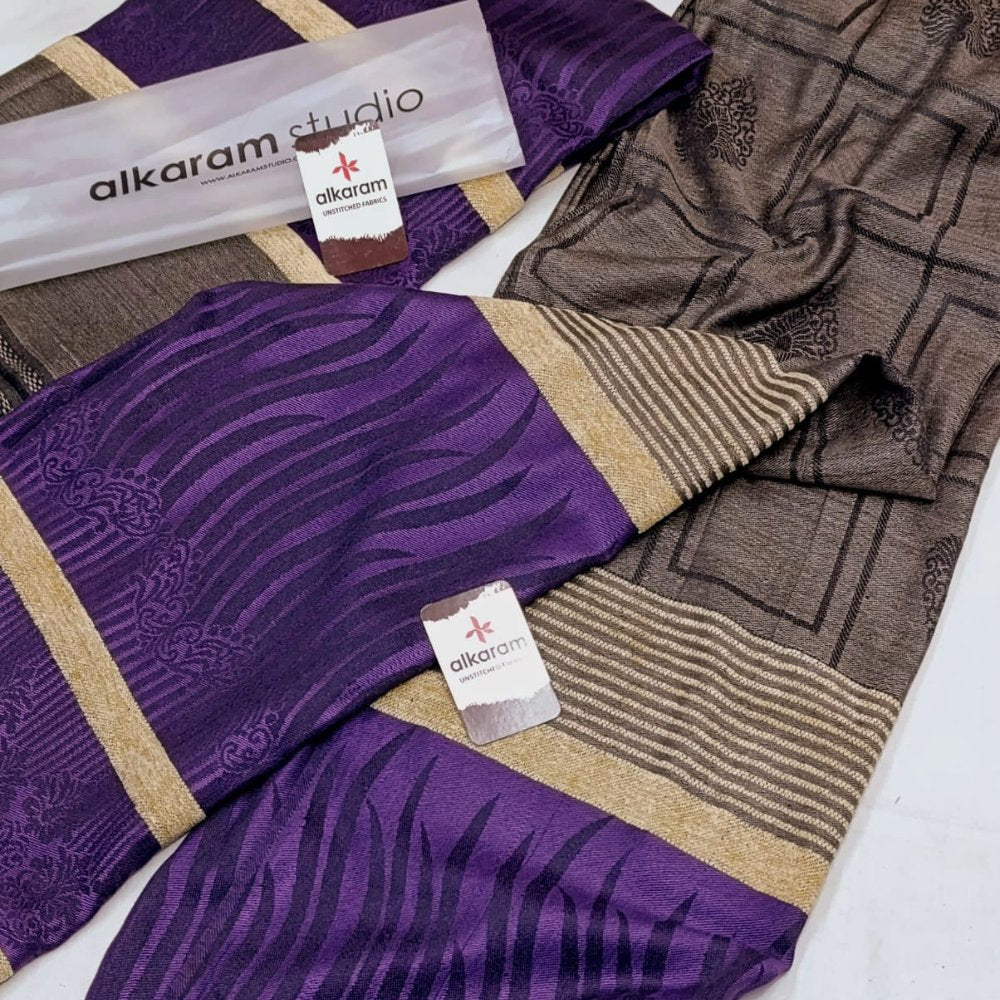 Purple, brown, and beige patterned fabric with 'alkaram studio' tags.