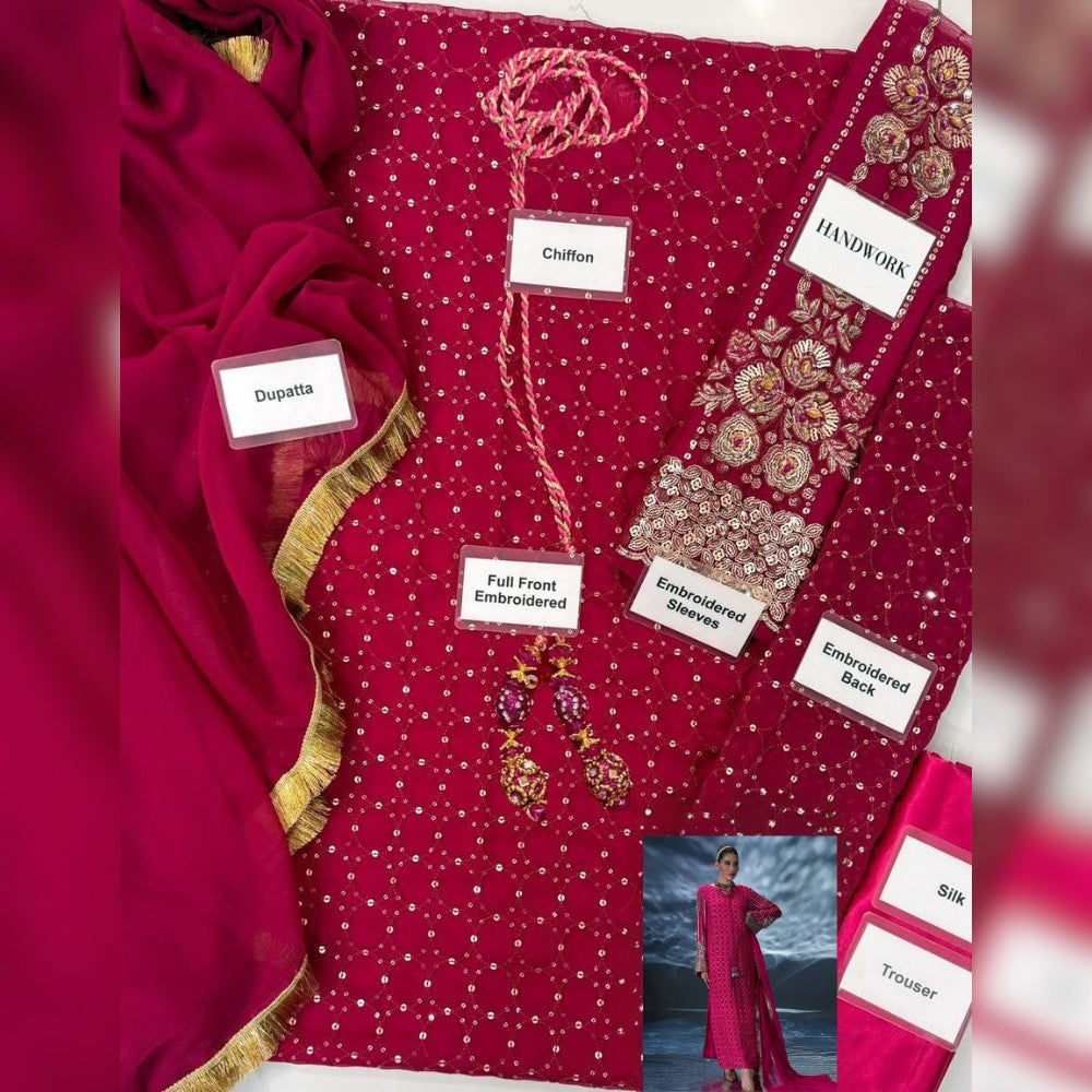 Red embroidered fabric with labels detailing its features, displayed on a white background.