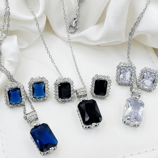 Front image of black, blue, and silver artificial locket sets