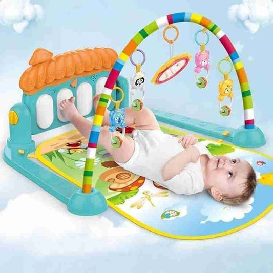 Baby looking and reaching toward hanging rattles