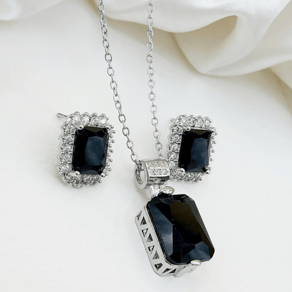 Front view of artificial black locket with matching earrings