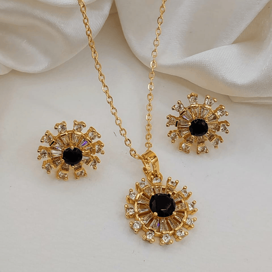 Black-toned artificial round locket set with matching earrings