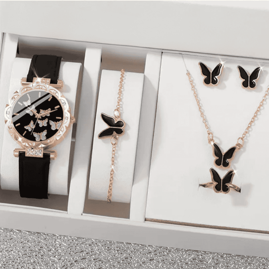 Watch, locket, ring & earrings placed inside gift box