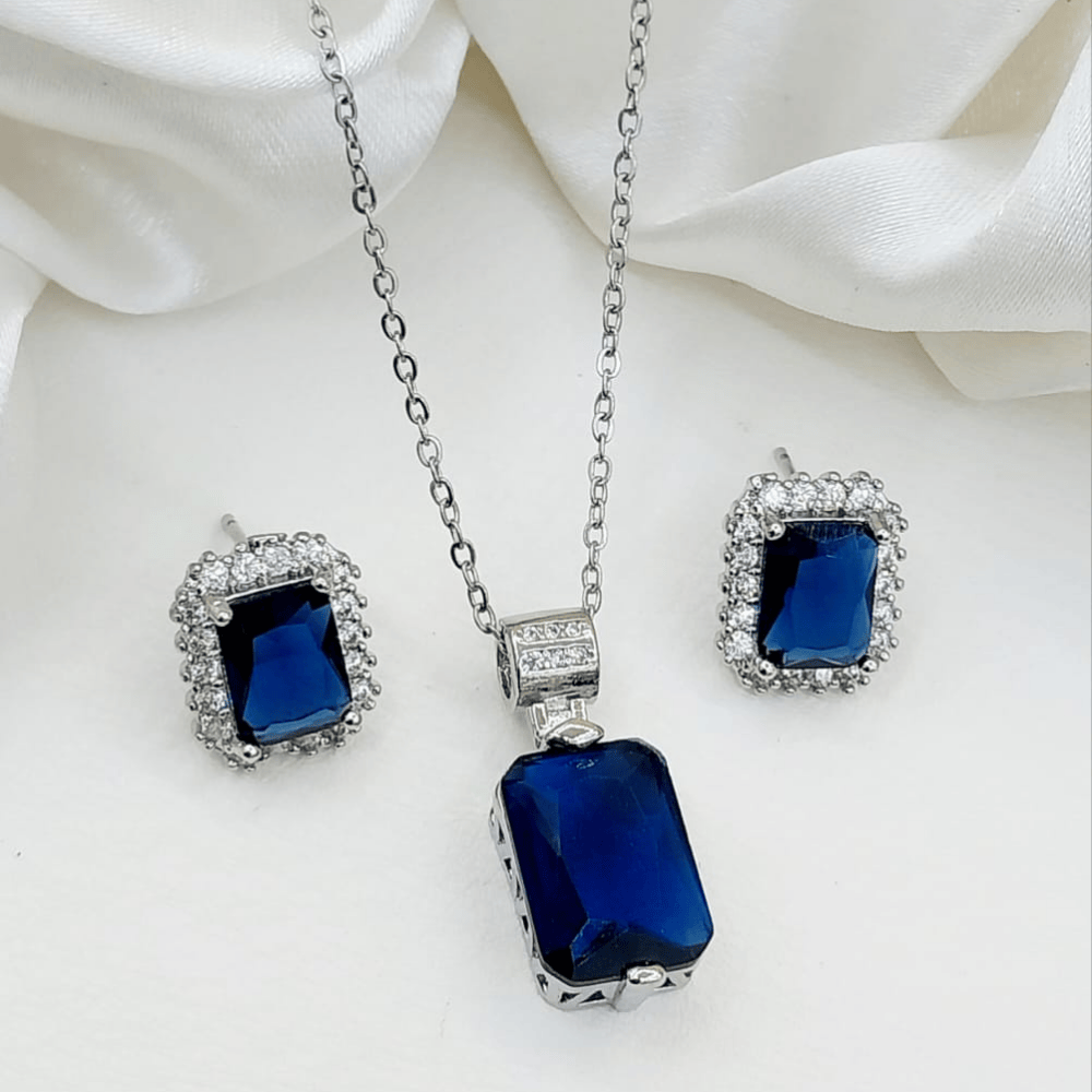 Blue locket and matching earrings set shown from the front