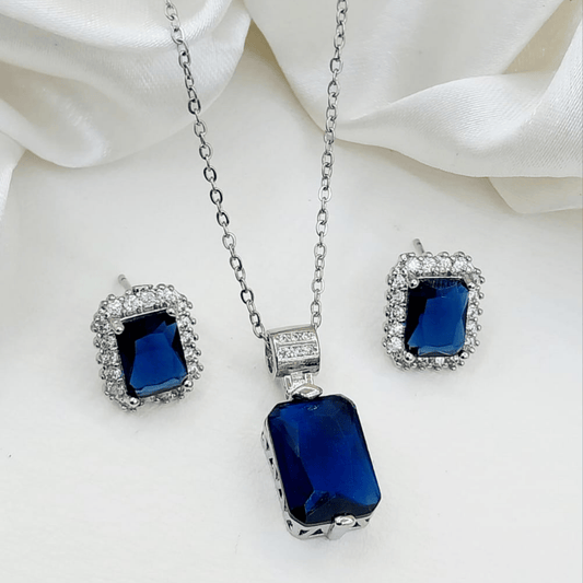 Blue locket and matching earrings set shown from the front