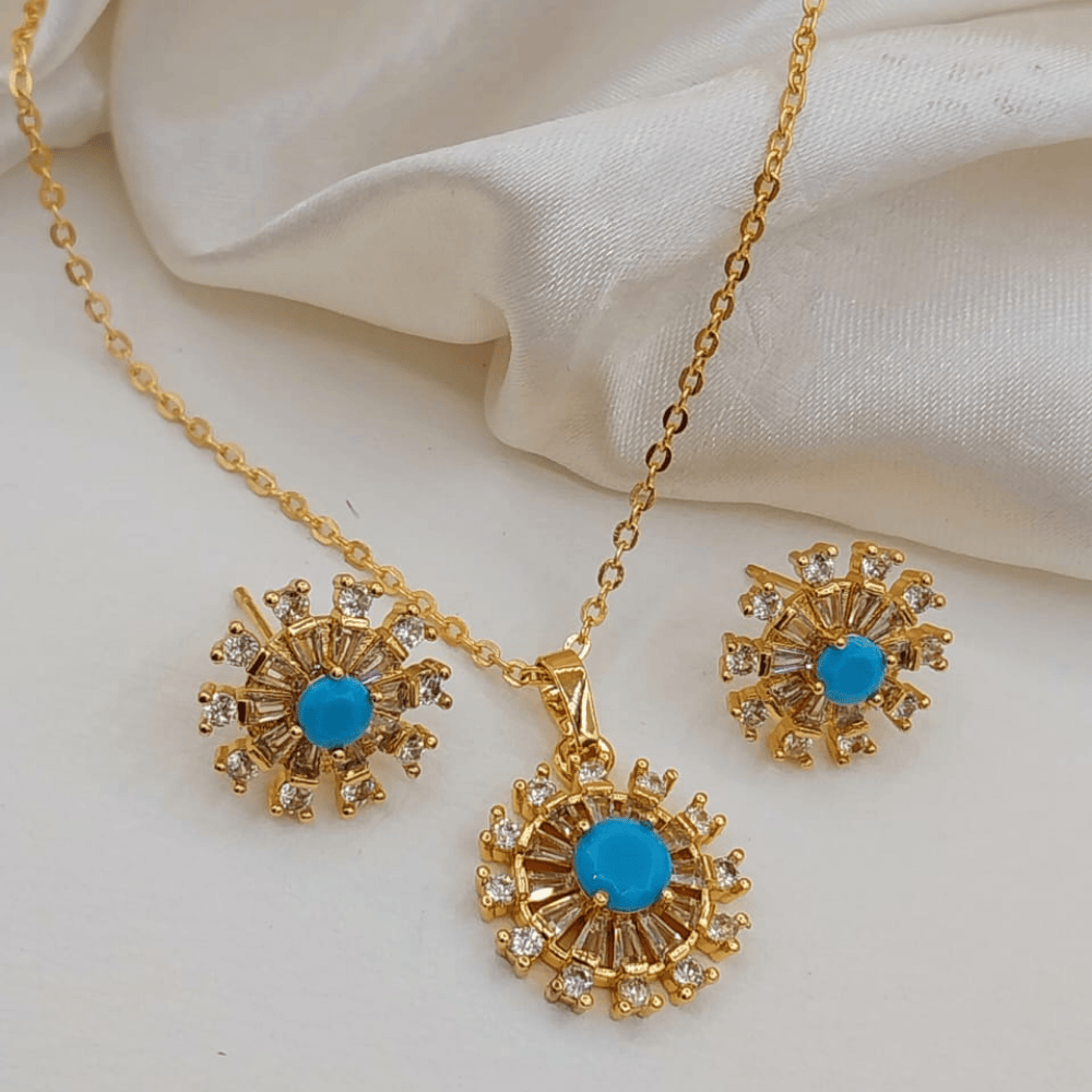 Blue artificial jewelry set with round locket and earrings