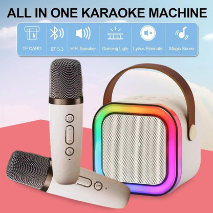 All-in-one karaoke machine with microphone and colorful speaker on a pink background