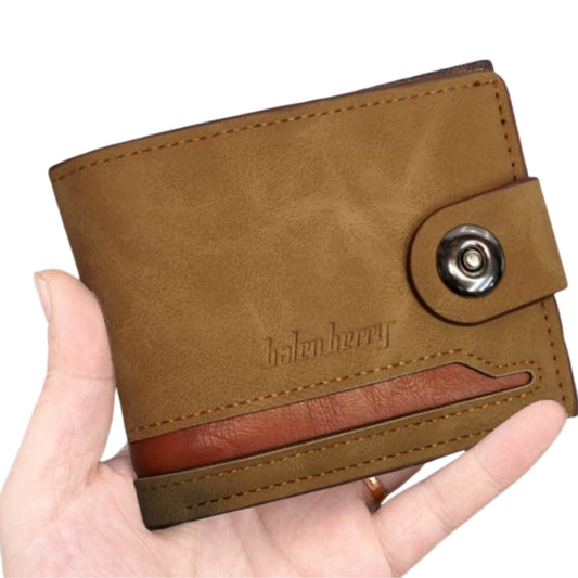 Brown leather wallet held in a hand with a white background
