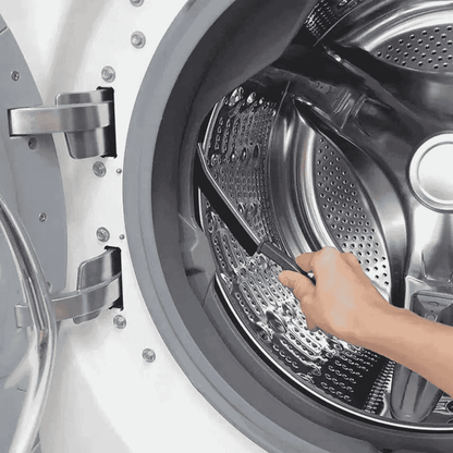 Cleaning brush shown on a stainless steel panel surface