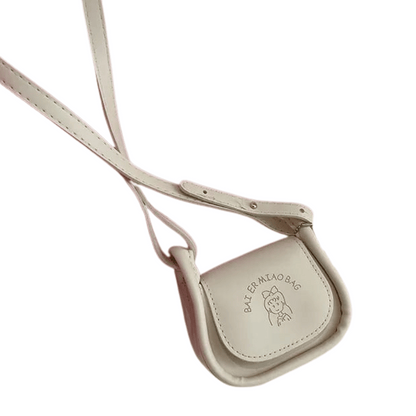 Beige crossbody bag with a strap on a white background