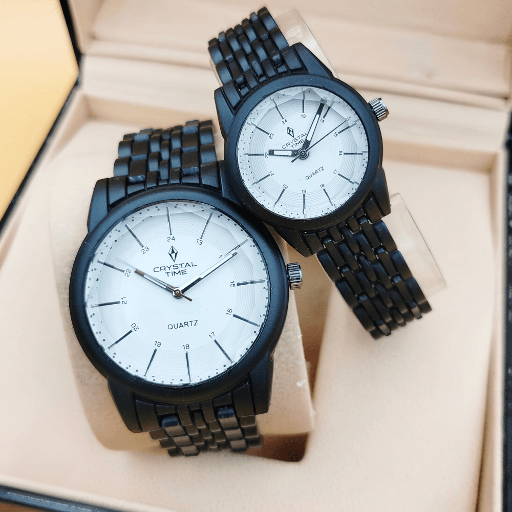Close-up of the black matte couple watch featuring a white dial.