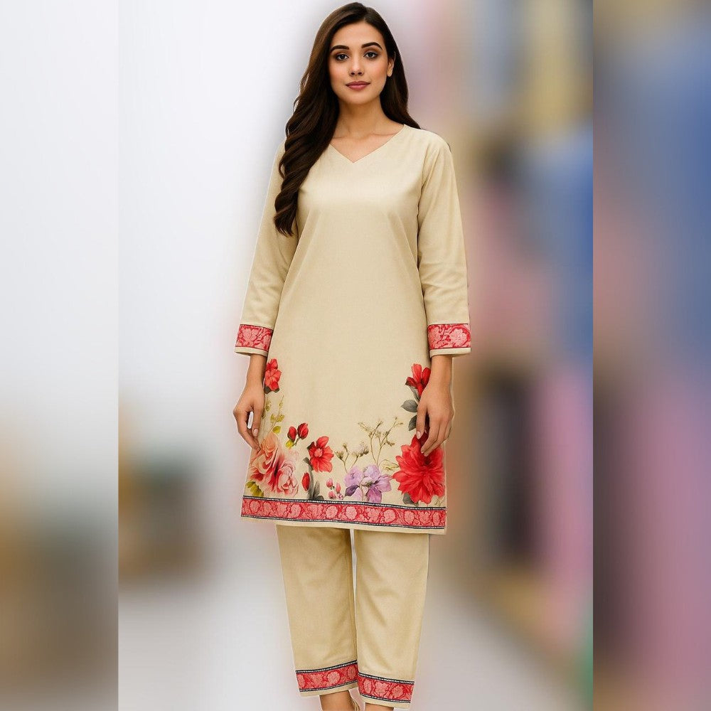 Woman wearing a beige outfit with floral embroidery on a blurred background