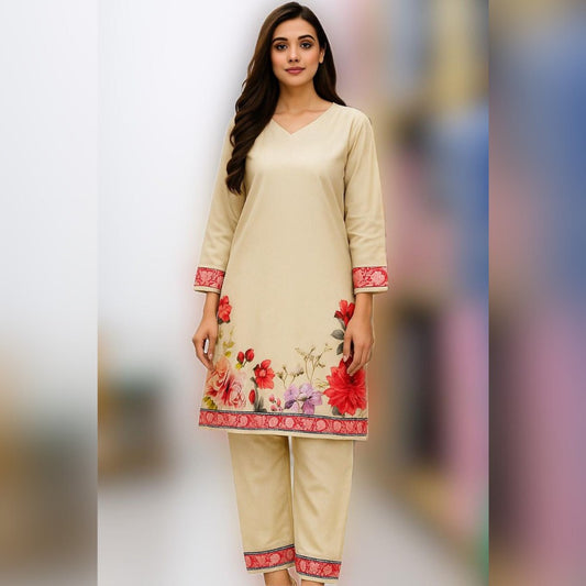 Woman wearing a beige outfit with floral embroidery on a blurred background