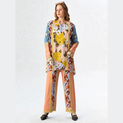 Woman wearing a colorful floral outfit on a white background