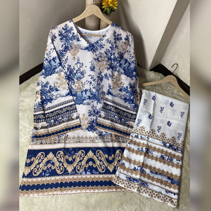 Blue and white patterned outfit on hangers against a neutral background